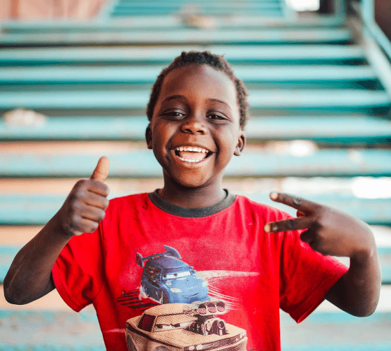 Child giving thumbs up